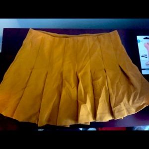 Mustard color pleated mini skirt